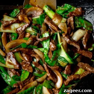 Stir-fried beef with mangetout, onions and pak choi in a glossy hoisin sauce