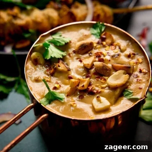 Authentic Caesar Salad Dressing Recipe You Can Make at Home 11 Satay sauce in a small copper pan topped with peanuts and coriander