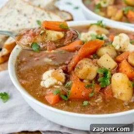 Corned beef hash soup in a bowl.