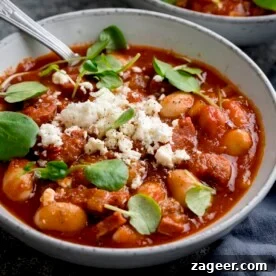 Butterbean and chorizo soup topped with feta and watercress.