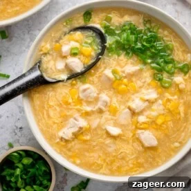 Chicken and sweetcorn soup topped with spring onions.