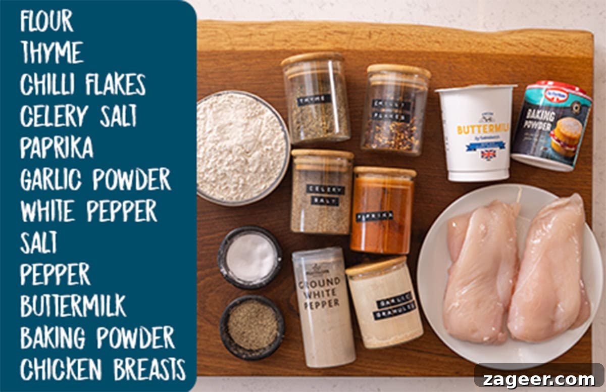 A wide, overhead shot of the ingredients for a buffalo chicken burger. The ingredients are all placed on a wooden cutting board, which is on top of a white marble surface. On the left side of the image, there is a large blue text box with a list of the ingredients in white text.