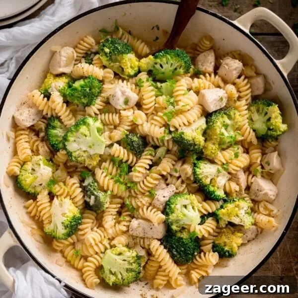 Slow-Cooked Cowboy Beans Recipe with Smoky Bacon and BBQ Flavors 9 Chicken and broccoli pasta in a white cast iron pan.