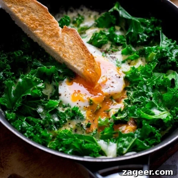 Creamy Egg Mayo Sandwich Recipe for Quick Meals 11 A toast soldier being dipped into a runny egg yolk in a pan of egg and cheesy kale