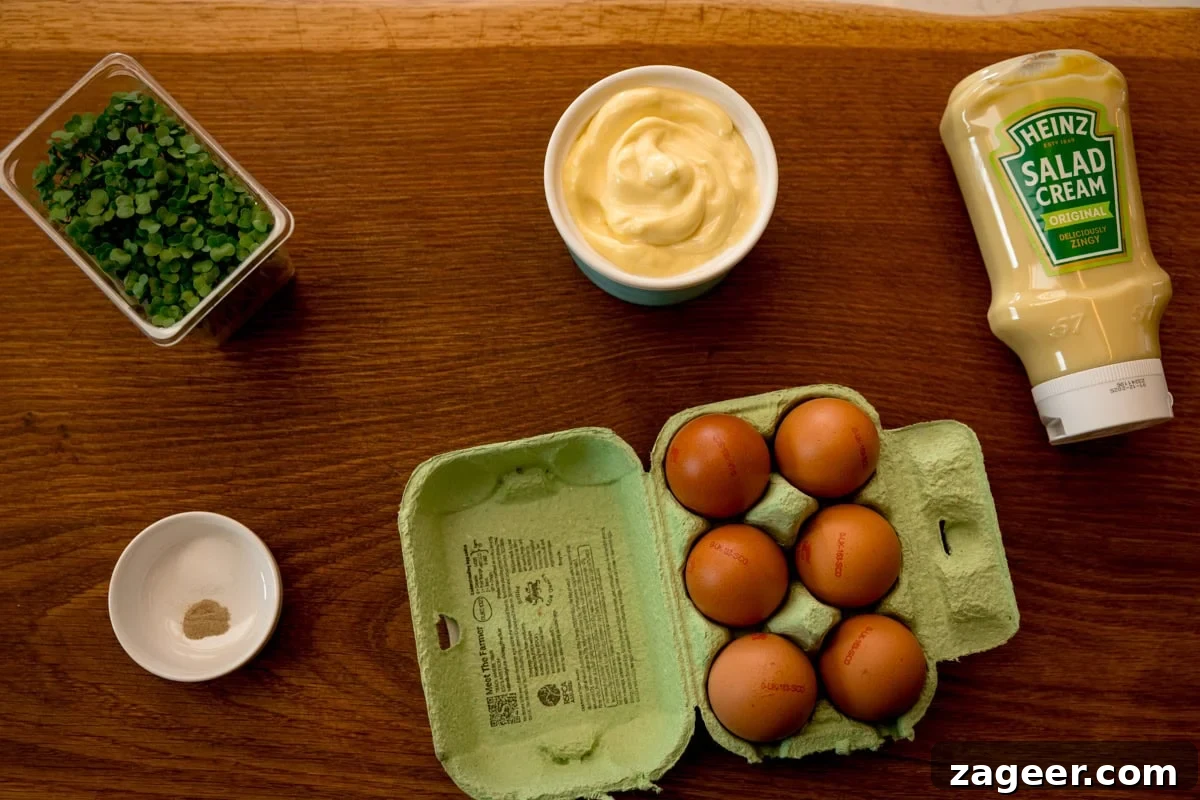 Creamy Egg Mayo Sandwich Recipe for Quick Meals 3 Ingredients for egg mayonnaise on a wooden board.