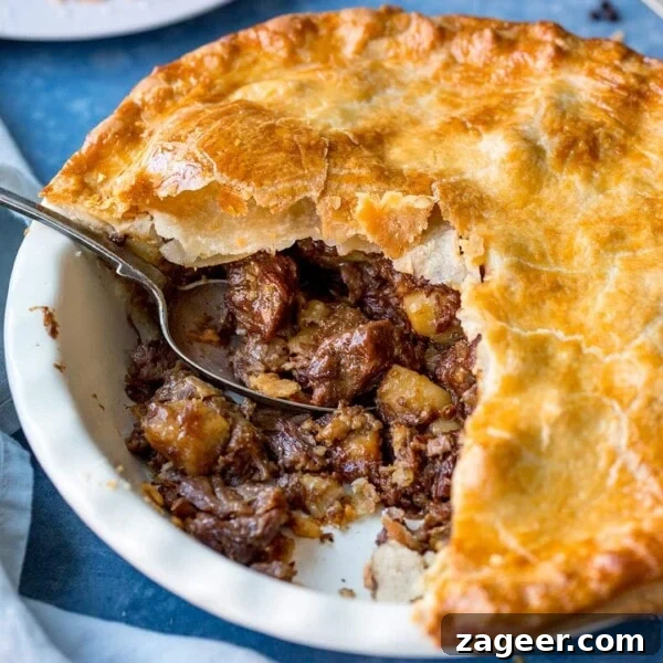 Savory Chicken and Ham Pie Recipe with Flaky Crust 8 Square image ofr steak and potato pie with slice taken out