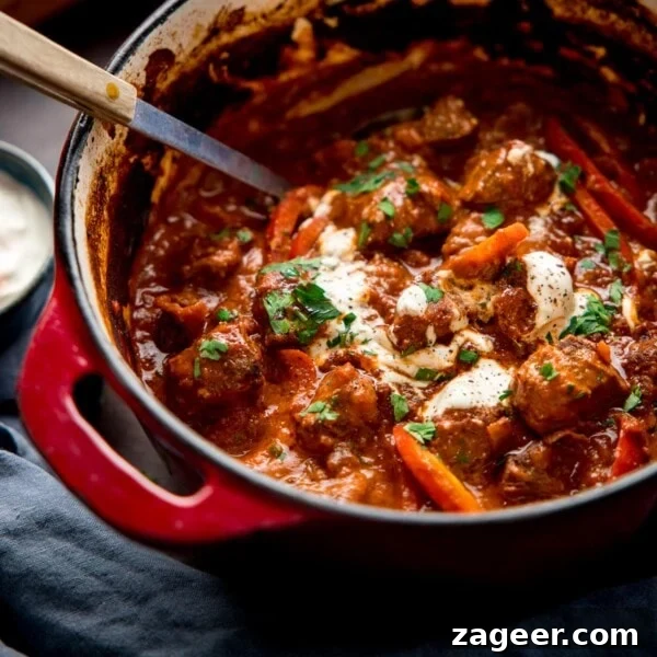 Classic Beef Bourguignon Recipe: Tender Braised Beef in Red Wine 11 Square image of beef goulash in a Dutch Oven pan
