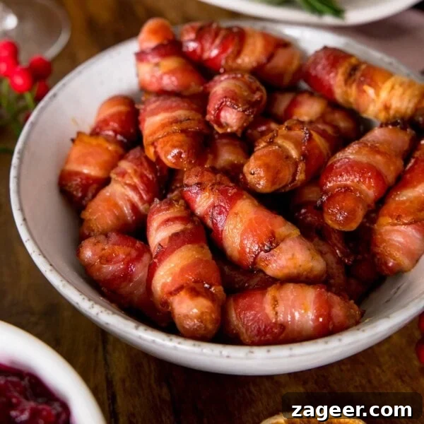 Cranberry and Brie Bites: Savory Holiday Appetizer Recipe 13 Sausages wrapped in bacon in a white bowl