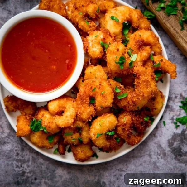 Cranberry and Brie Bites: Savory Holiday Appetizer Recipe 8 Plate of coconut shrimp with a bowl of sweet and sour sauce nestled in.