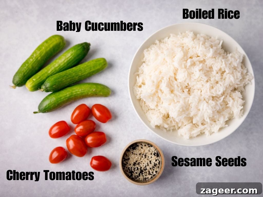 Labelled ingredients of baby cucumbers, cherry tomatoes, sesame seeds and boiled rice in a bowl on a light grey background.