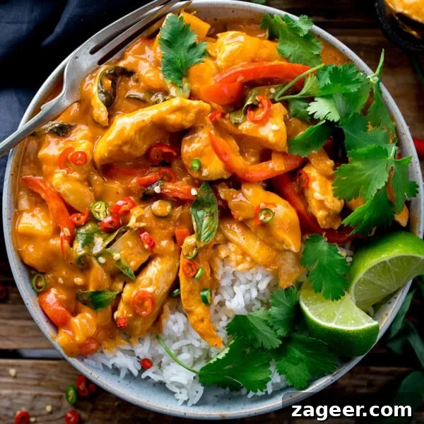 Authentic Thai Beef Massaman Curry Recipe for Home Cooking 12 A bowl of Thai Chicken Curry with rice and lime wedges