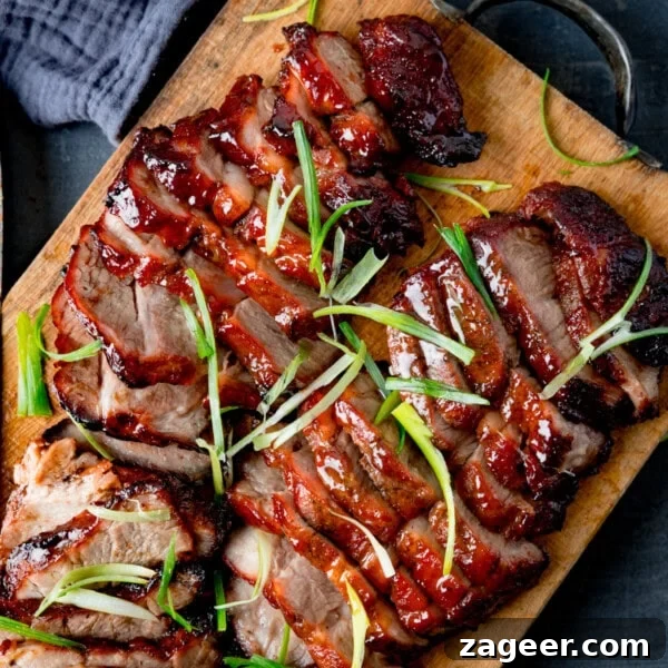 How to Make Soft, Chewy Dough Balls for Any Recipe 6 Sliced glazed char siu pork garnished with thin strips of spring onion, served on a wooden chopping board.