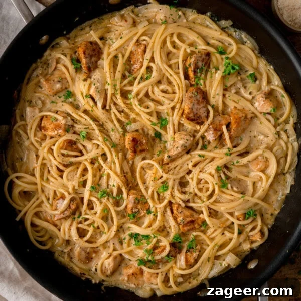 How to Make Soft, Chewy Dough Balls for Any Recipe 8 Overhead square image of a skillet filled with creamy Garlic Butter Chicken Pasta, pan-fried chicken pieces, chopped parsley, and a sprinkle of black pepper on top.
