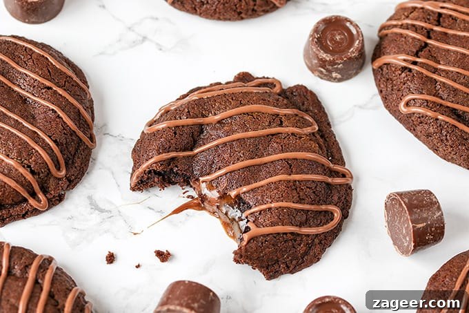 Gooey Rolo-Stuffed Chocolate Chip Cookies 5 Gooey Rolo Stuffed Cookies. Chewy Chocolate cookies with a gooey Rolo centre!