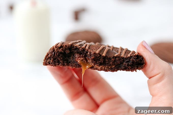 Gooey Rolo-Stuffed Chocolate Chip Cookies 6 Gooey Rolo Stuffed Cookies. Chewy Chocolate cookies with a gooey Rolo centre!