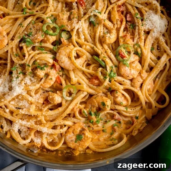 Lemon-Feta Baked Fish Recipe for Flaky, Flavorful Fillets 8 square overhead image of a pan of prawn linguine in a creamy buffalo sauce.