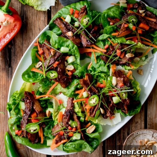 Turkey Lettuce Wrap Recipe: Flavorful Low-Carb Meal Ideas 8 White plate full of Korean beef lettuce wraps