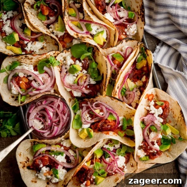 Chicken Tikka Pizza Recipe: Crispy Homemade Tandoori-Style Pizza 10 A tray of spicy bean tacos filled with avocado, cheese, red onions, and greens.