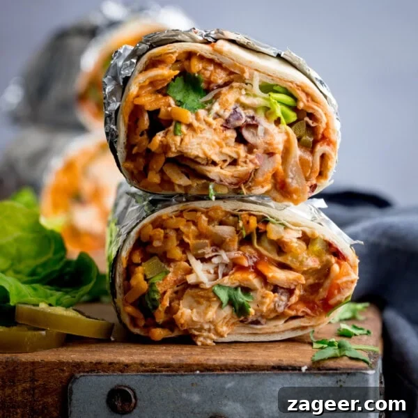 Chicken Tikka Pizza Recipe: Crispy Homemade Tandoori-Style Pizza 9 Two halves of a rotisserie chicken burrito packed with rice, rotisserie chicken, cheese, beans, and vegetables.