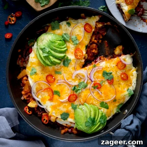 Slow-Cooker Salsa Chicken Recipe for Flavor-Packed Weeknight Meals 11 Chorizo and bean layered tortilla pan topped with avocado and chillies.