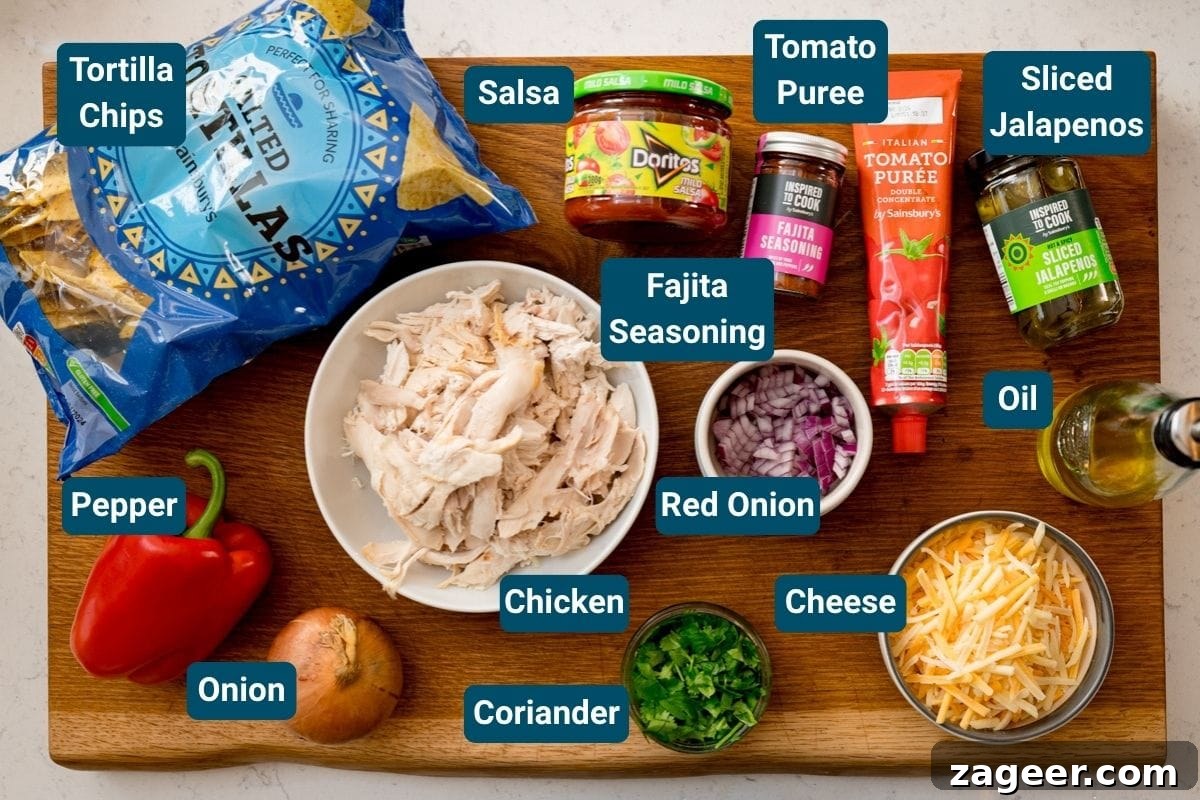 Slow-Cooker Salsa Chicken Recipe for Flavor-Packed Weeknight Meals 4 A wooden board holds ingredients for a delicious baked salsa chicken: tortilla chips, salsa, tomato purée, jalapeños, oil, cheese, coriander, shredded chicken, fajita seasoning, red onion, onion and a red pepper.