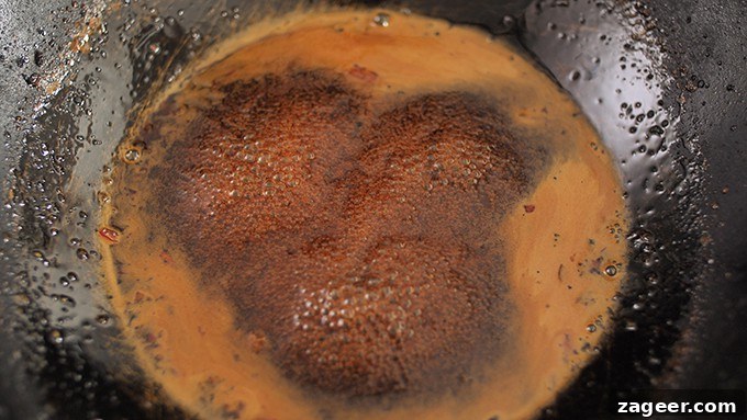 Asian style sauce simmering in wok