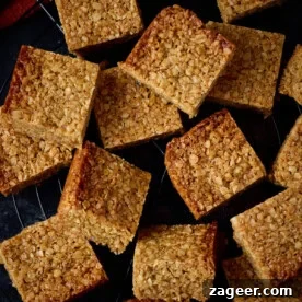 15 Cozy Autumn Baking Ideas for Weekend Treats 12 Golden flapjacks on a wooden board.
