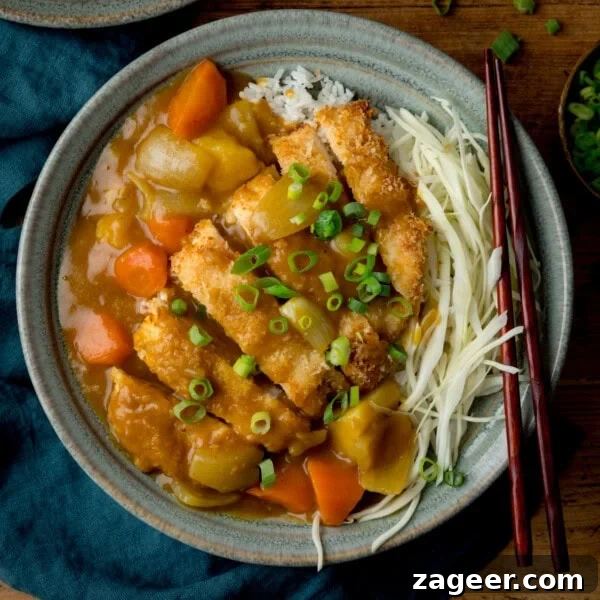Homemade Thai Yellow Curry with Fish Recipe 7 A bowl of Chicken Katsu Curry with rice and vegetables.