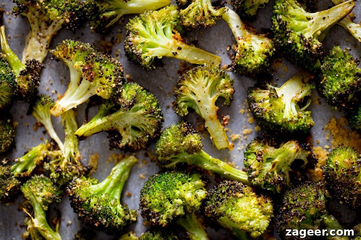 Creamy Ham and Spring Pea Risotto Recipe 6 Roasted broccoli with garlic spread out on a white tray
