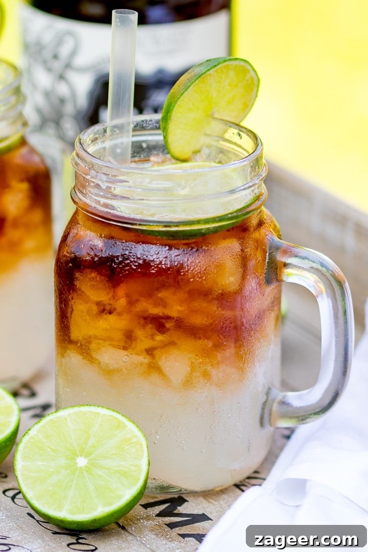 Dark ’N’ Stormy Cocktail Recipe: Classic Rum & Ginger Mix 6 Dark and stormy cocktail in a glass with a slice of lime