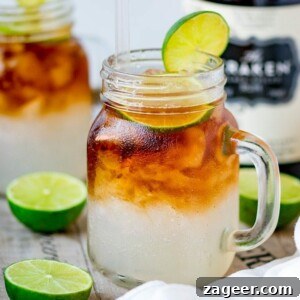 Dark ’N’ Stormy Cocktail Recipe: Classic Rum & Ginger Mix 8 Mason jar glass filled with dark and stormy cocktail, topped with a slice of lime