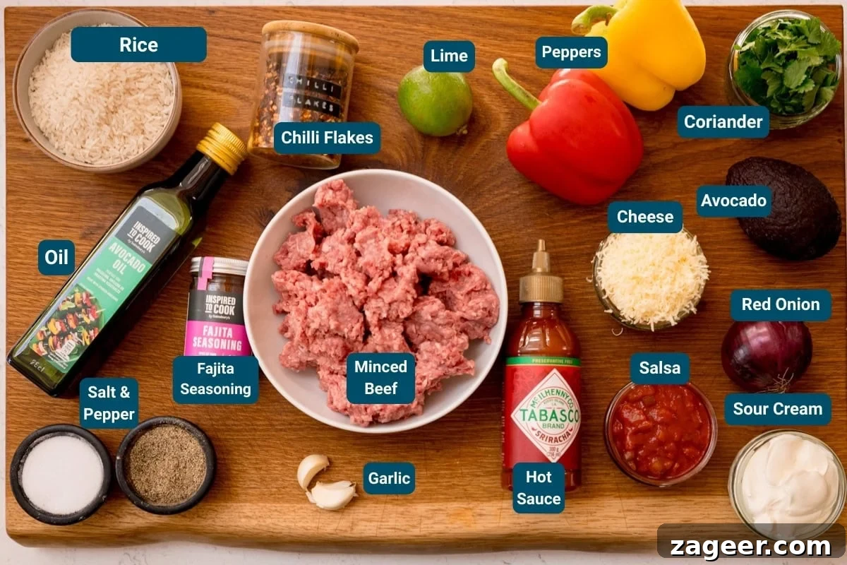 Spiced Minced Beef Fajita Bowls with Peppers and Rice 4 A wooden board displays labelled ingredients for making beef fajita bowls, including minced beef, rice, vegetables, spices, oil, cheese, salsa, avocado, soured cream and hot sauce.