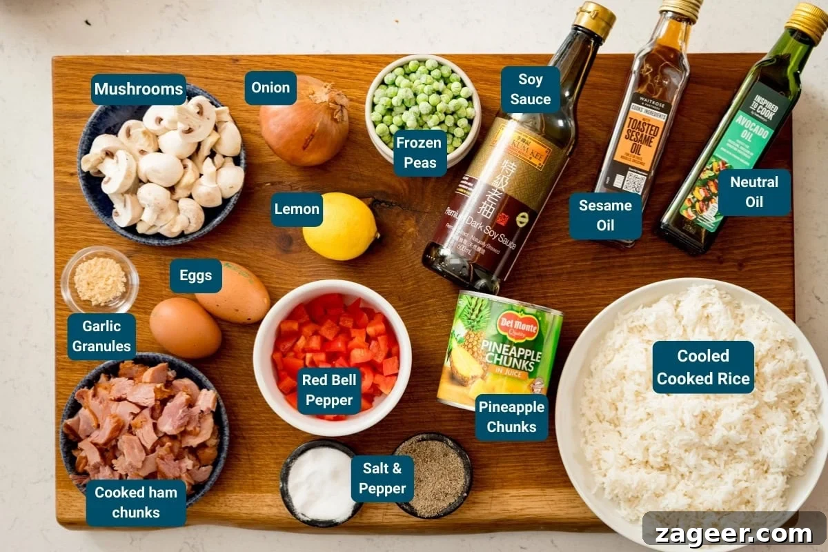 A wooden board with ingredients for ham and pineapple fried rice