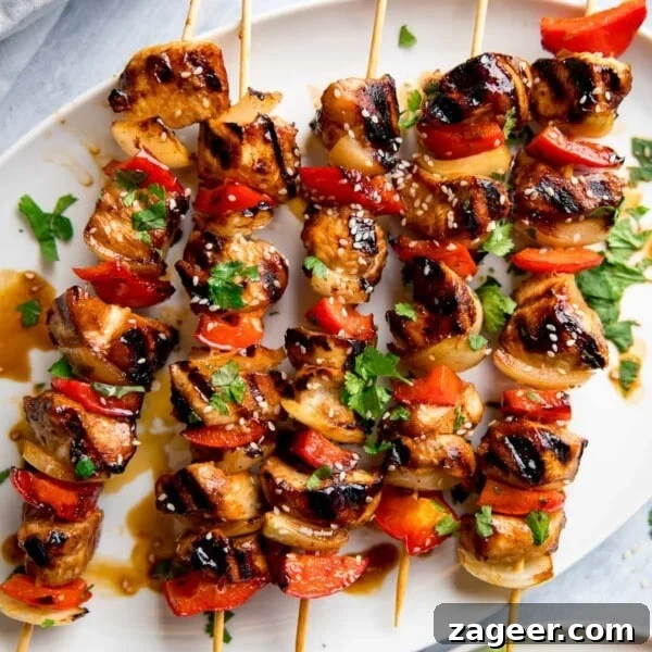 Honey Garlic Prawn Rice Bowl Recipe for Quick Weeknight Meals 10 honey garlic chicken skewers on a white plate