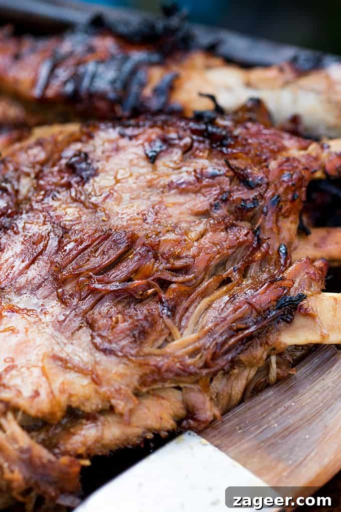 Sticky Slow-Cooked BBQ Ribs You Can Make at Home 2 Rack of ribs on a tray - cooked with sticky glaze