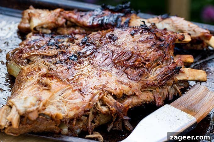 Sticky Slow-Cooked BBQ Ribs You Can Make at Home 4 Wide shot of rack of cooked BBQ ribs