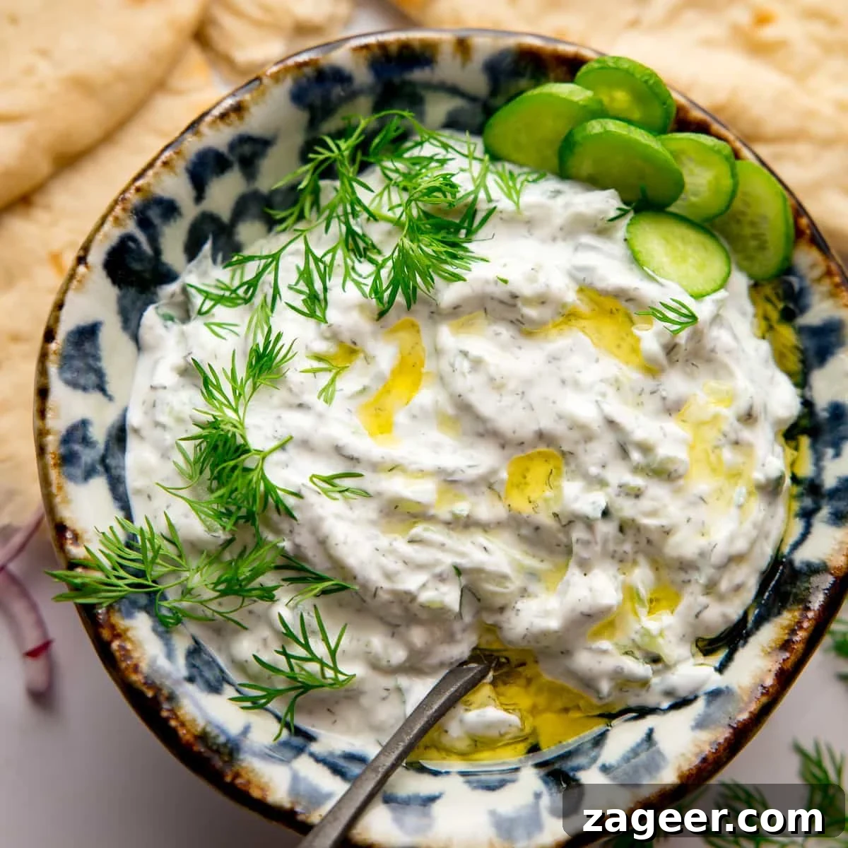 Bowl of Tzatziki with a spoon in
