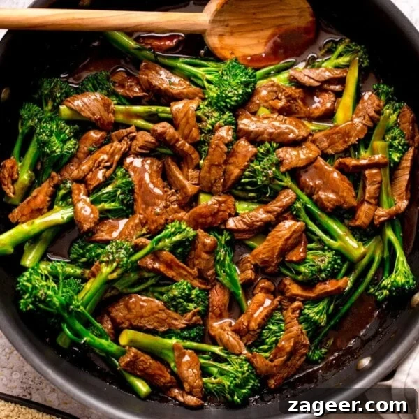 Authentic Chinese-Style Beef Curry Recipe for Home Cooking 9 beef and broccoli stir fry in a pan with a wooden spoon