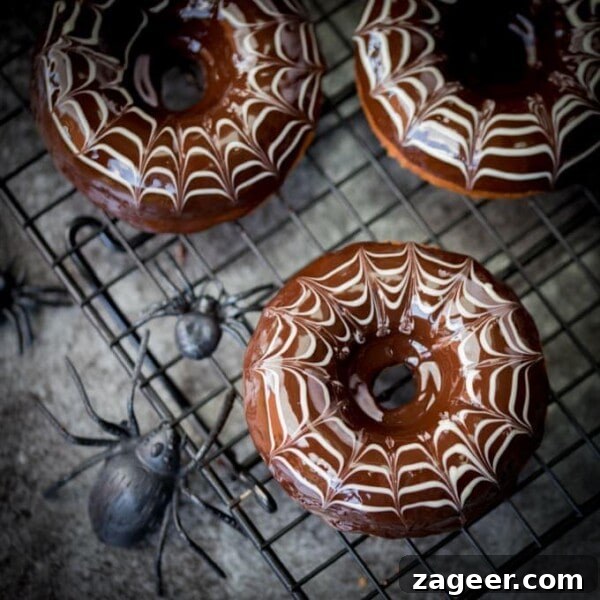 Spider Web Chocolate Cupcakes for Halloween Parties 9 These baked Halloween Spider Web Doughnuts are easy to make and look fab on your party table!
