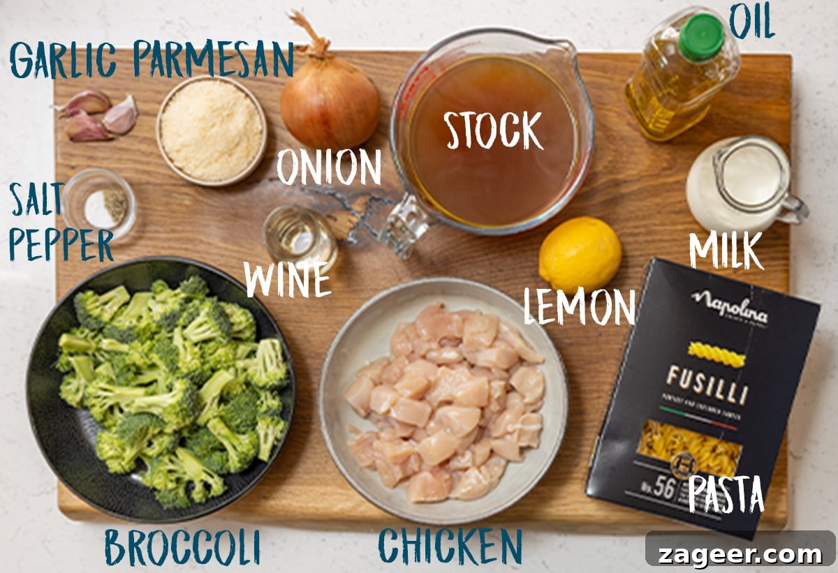 One-Pot Chicken and Broccoli Pasta Dinner in 30 Minutes 4 Ingredients for chicken and broccoli pasta on a wooden board.