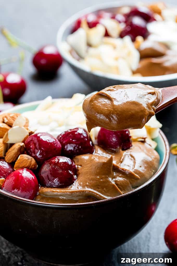 Avocado chocolate mousse bowl with roasted cherries - sweet, indulgent but healthier too!