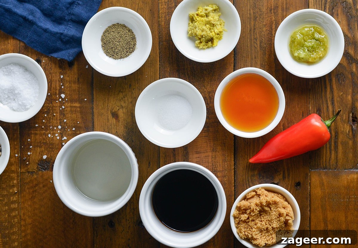 Ingredients for a sticky chilli glaze on a wooden table