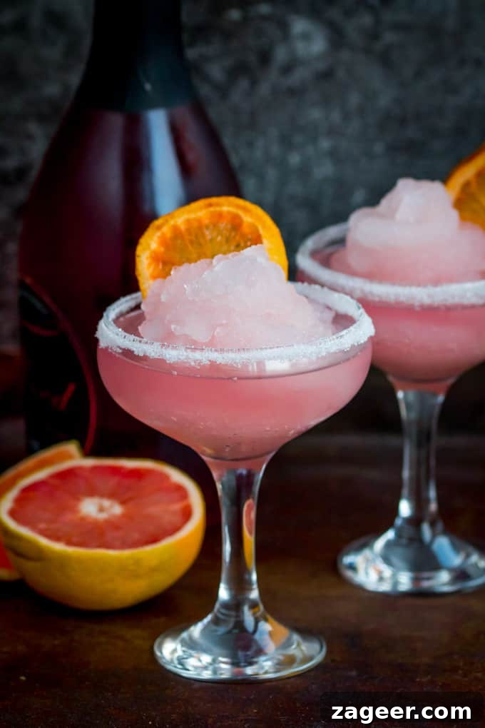 Frozen Pink Grapefruit Prosecco Spritz Recipe 2 Frozen Pink Grapefruit Prosecco Cocktail - A pretty, cooling drink to kick off Spring! It's like a slush puppie for grown ups...