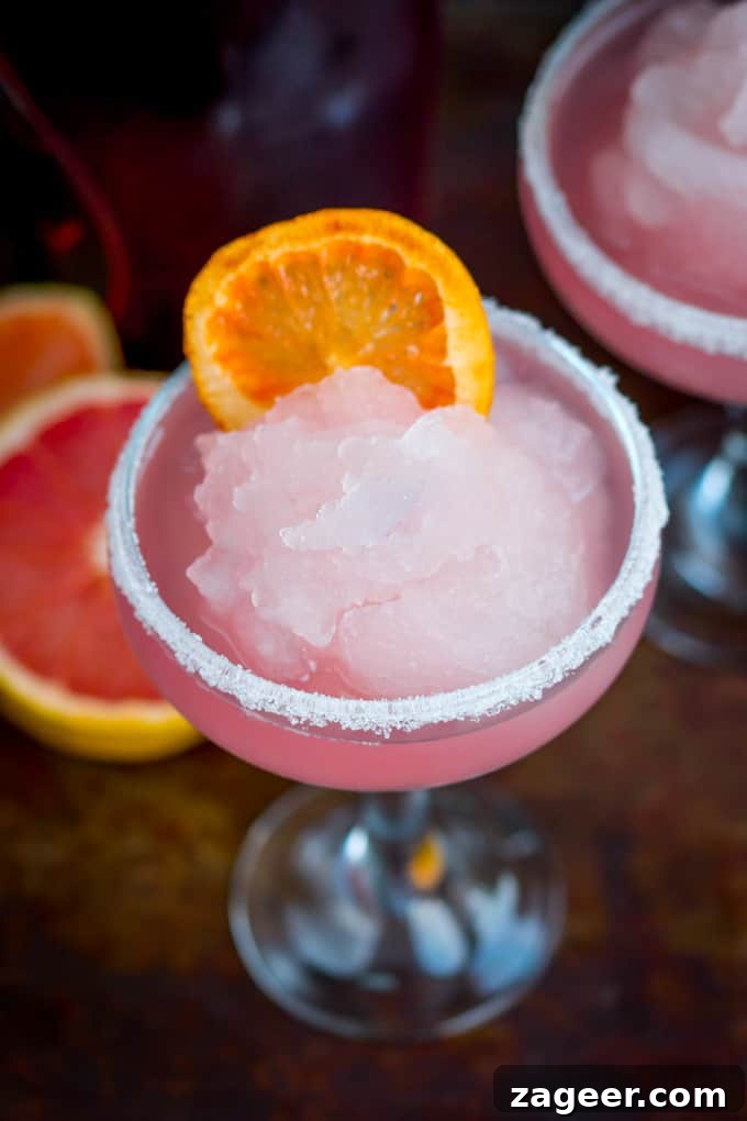 Frozen Pink Grapefruit Prosecco Spritz Recipe 3 Frozen Pink Grapefruit Prosecco Cocktail - A pretty, cooling drink to kick off Spring! It's like a slush puppie for grown ups...