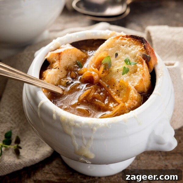 Hearty Pulled Pork and White Bean Soup Recipe 12 French Onion Soup in a white bowl.