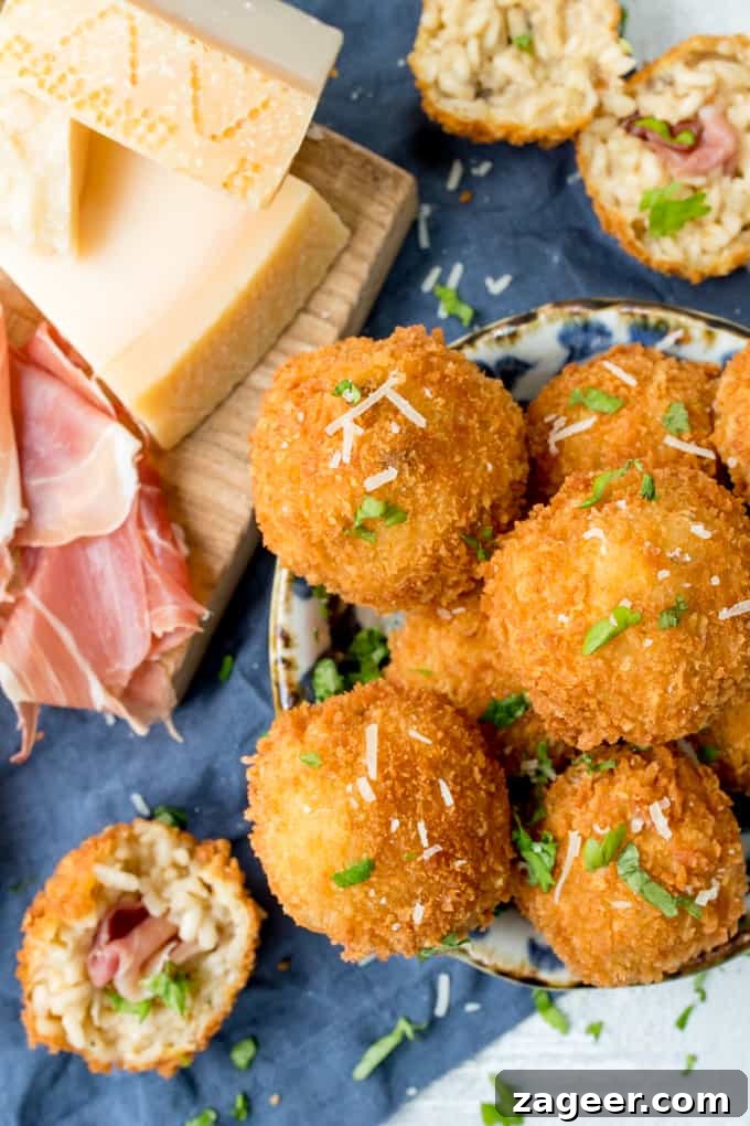 Prosciutto di San Daniele Arancini with Mushroom & Grana Padano 2 Arancini makes such a great appetiser or party food - these ones are made with creamy Grana Padano Cheese and Stuffed with Prosciutto di San Daniele!