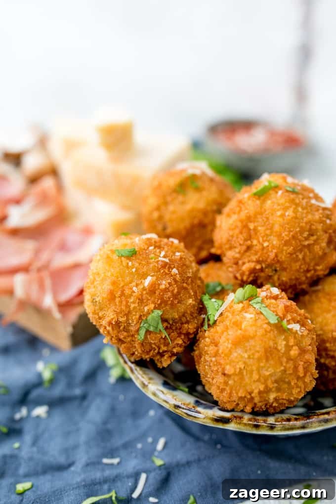 Prosciutto di San Daniele Arancini with Mushroom & Grana Padano 5 Arancini makes such a great appetiser or party food - these ones are made with creamy Grana Padano Cheese and Stuffed with Prosciutto di San Daniele!
