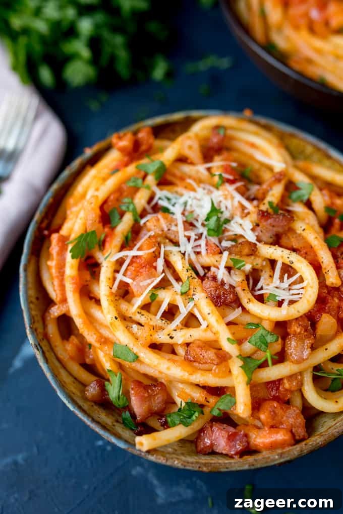 Authentic Amatriciana Pasta Recipe: Classic Roman Sauce Guide 5 Close up portrait photo of Amatriciana pasta in a bowl