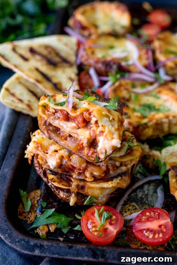Lasagna-Stuffed Potato Skins with Melty Cheese and Meat 2 Lasagne Potato Skins - recipe makes 8 potato skins plus a four-person lasagne.