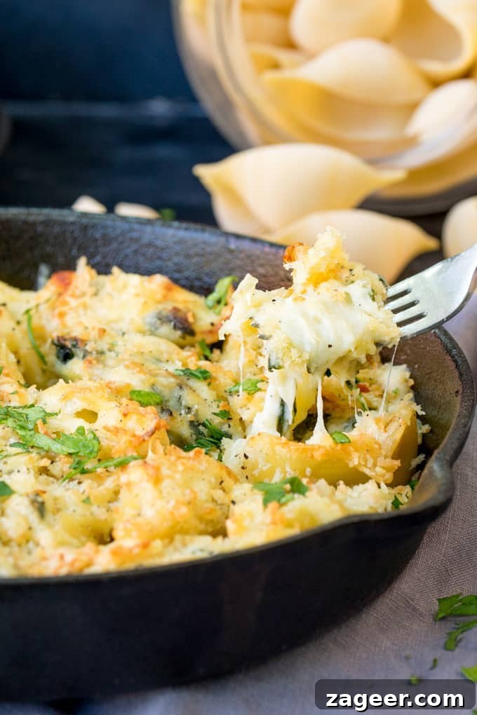 Garlic Spinach Stuffed Shells — Performing at the Big Feastival 3 These garlic and spinach stuffed pasta shells are creamy, cheesy and delicious! A meat-free meal that the kids love too!